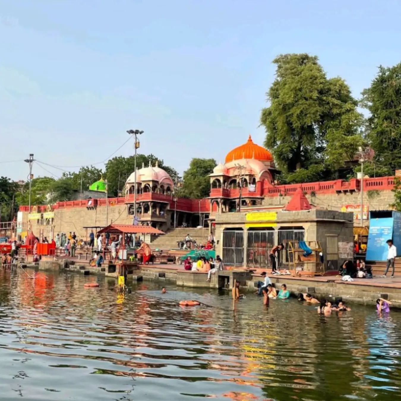 Ram Ghat on the Shipra river with temples along the steps